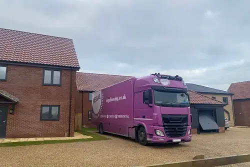Regal Moving & Storage truck and trailer outside a client's home during a removals Rainham job
