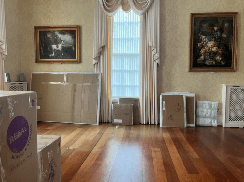 Regal Moving & Storage moving box with picture frames and fine art packed