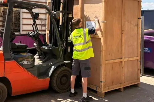 Regal Moving & Storage team member applying a label to a storage container