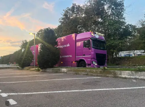Regal Moving & Storage purple removal truck parked in lorry parking bays