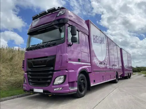 Regal Moving & Storage purple removal truck parked roadside